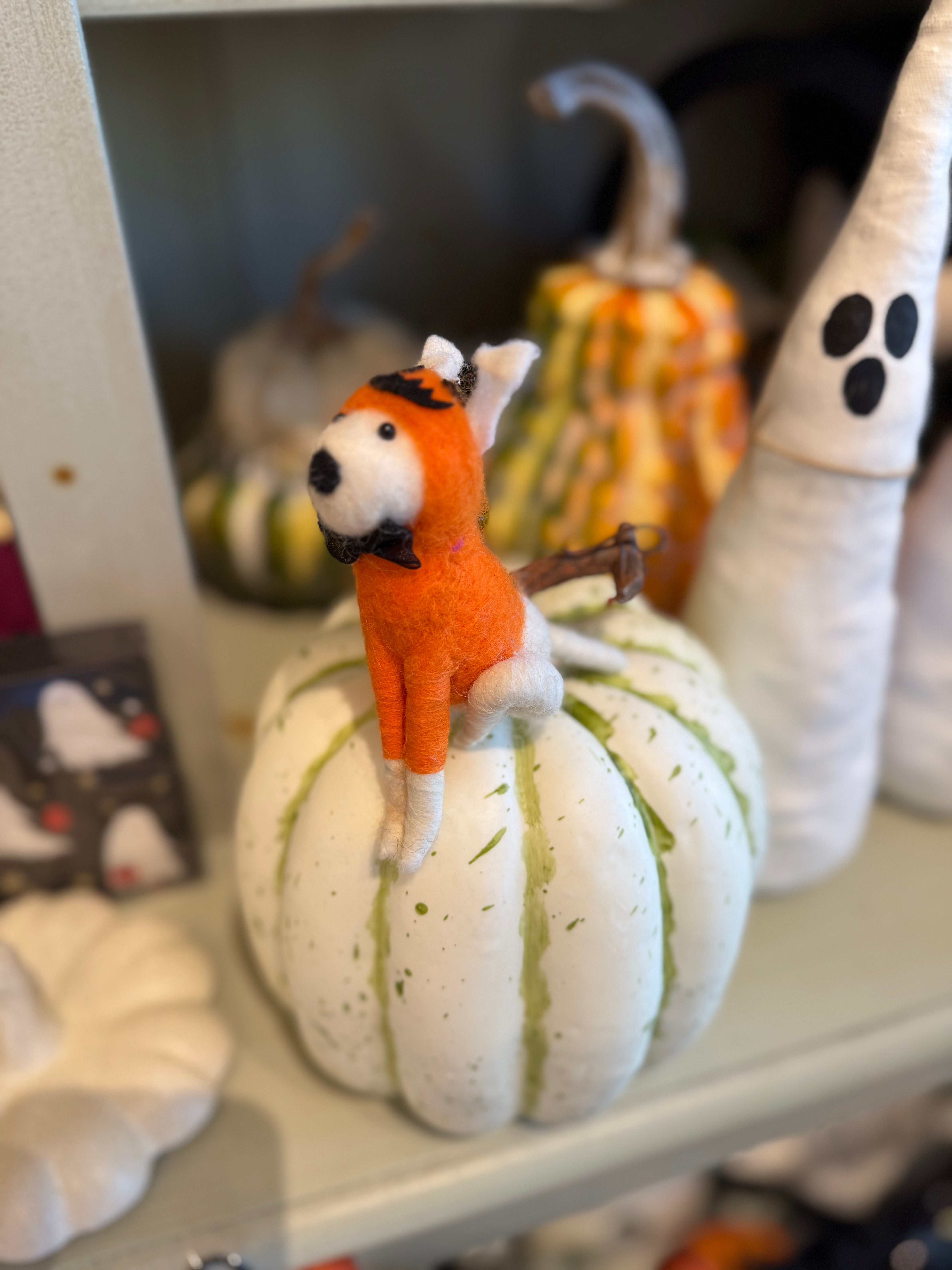 white felt dog in pumpkin costume ornament